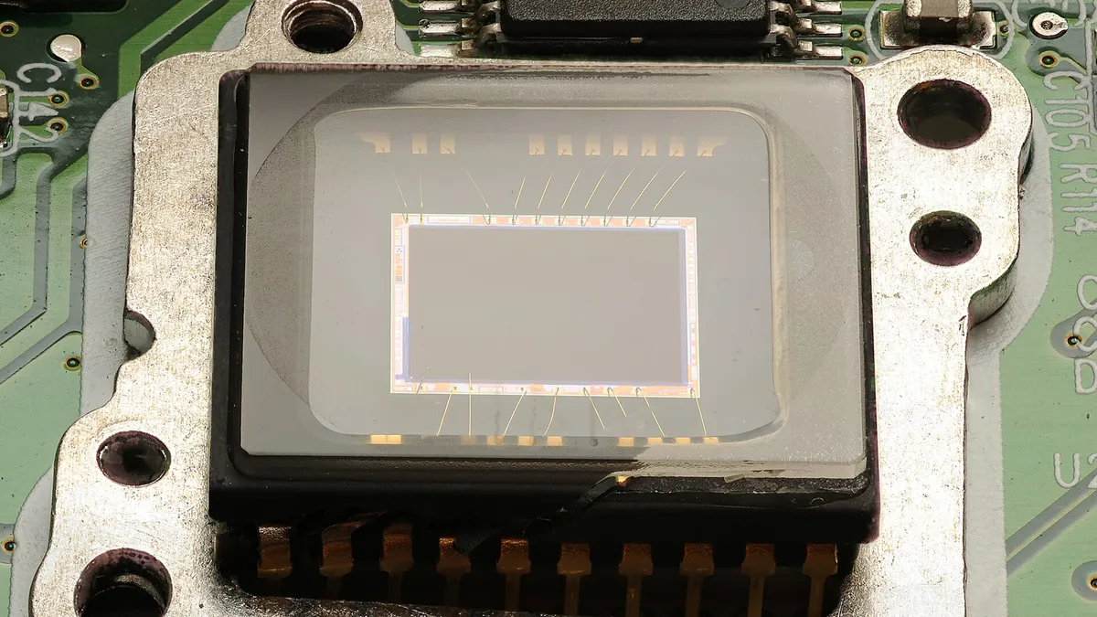 MEMS pressure sensor die soldered onto a green circuit board