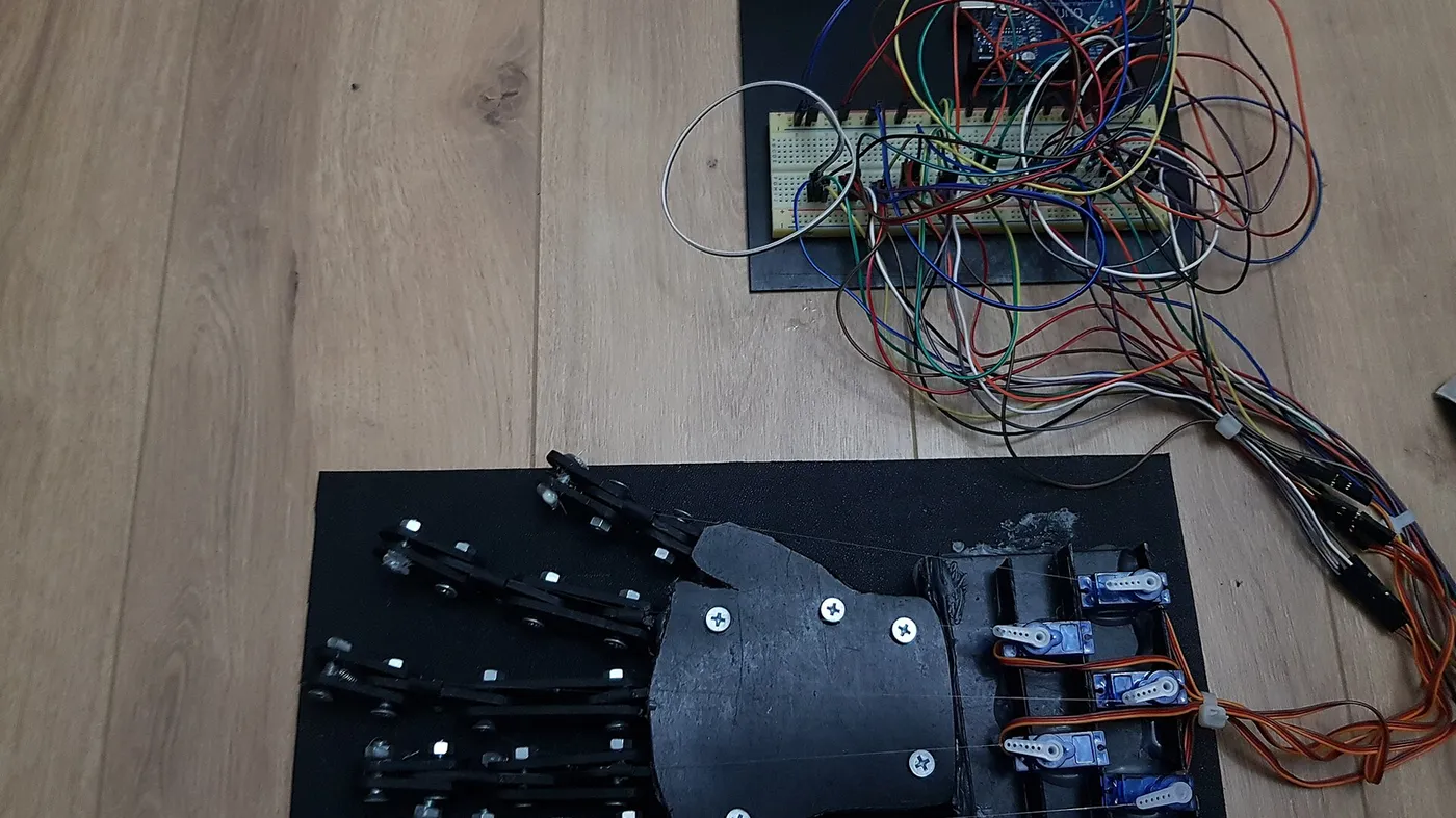 Sensor board with multicoloured ribbon wiring on a workbench