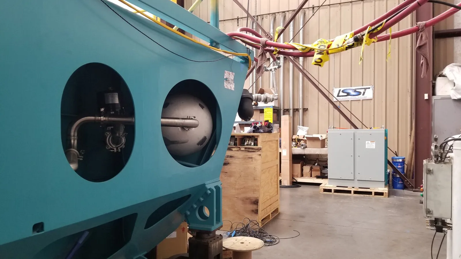 Machine with copper coil tubing and sensor cable terminations in a workshop