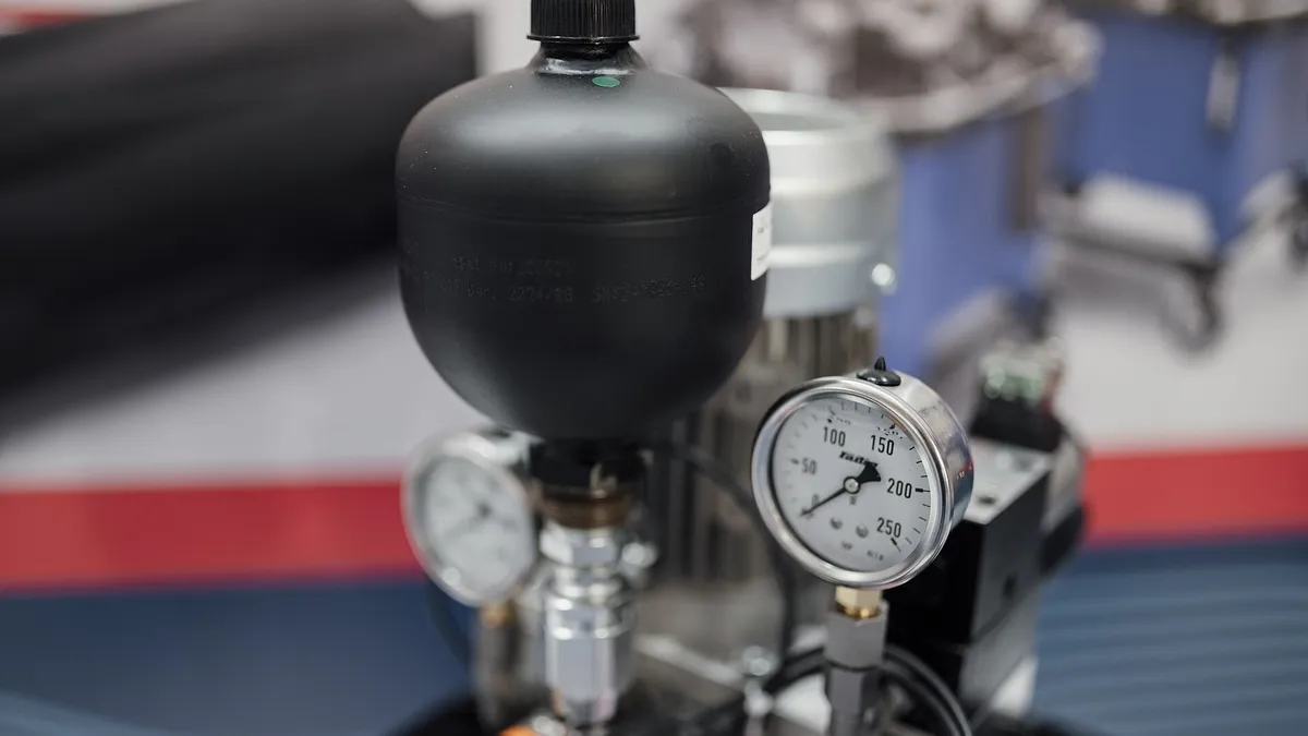 Process gauge with black pulse snubber mounted on equipment