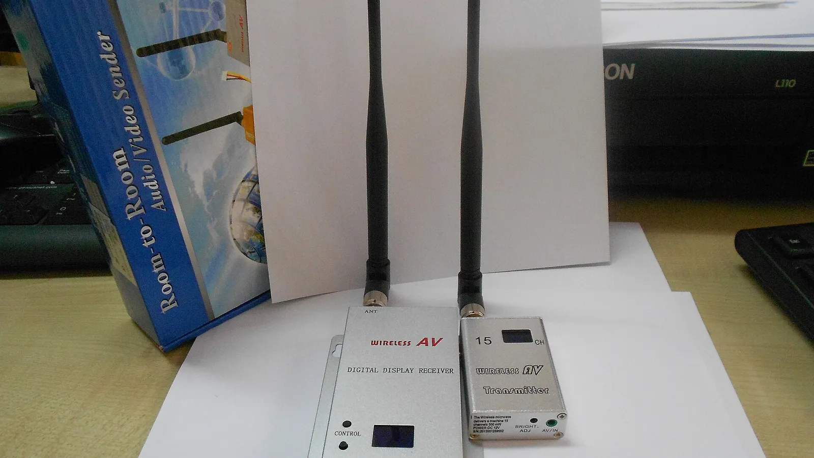 Two wireless pressure transducer units with antennas on a desk